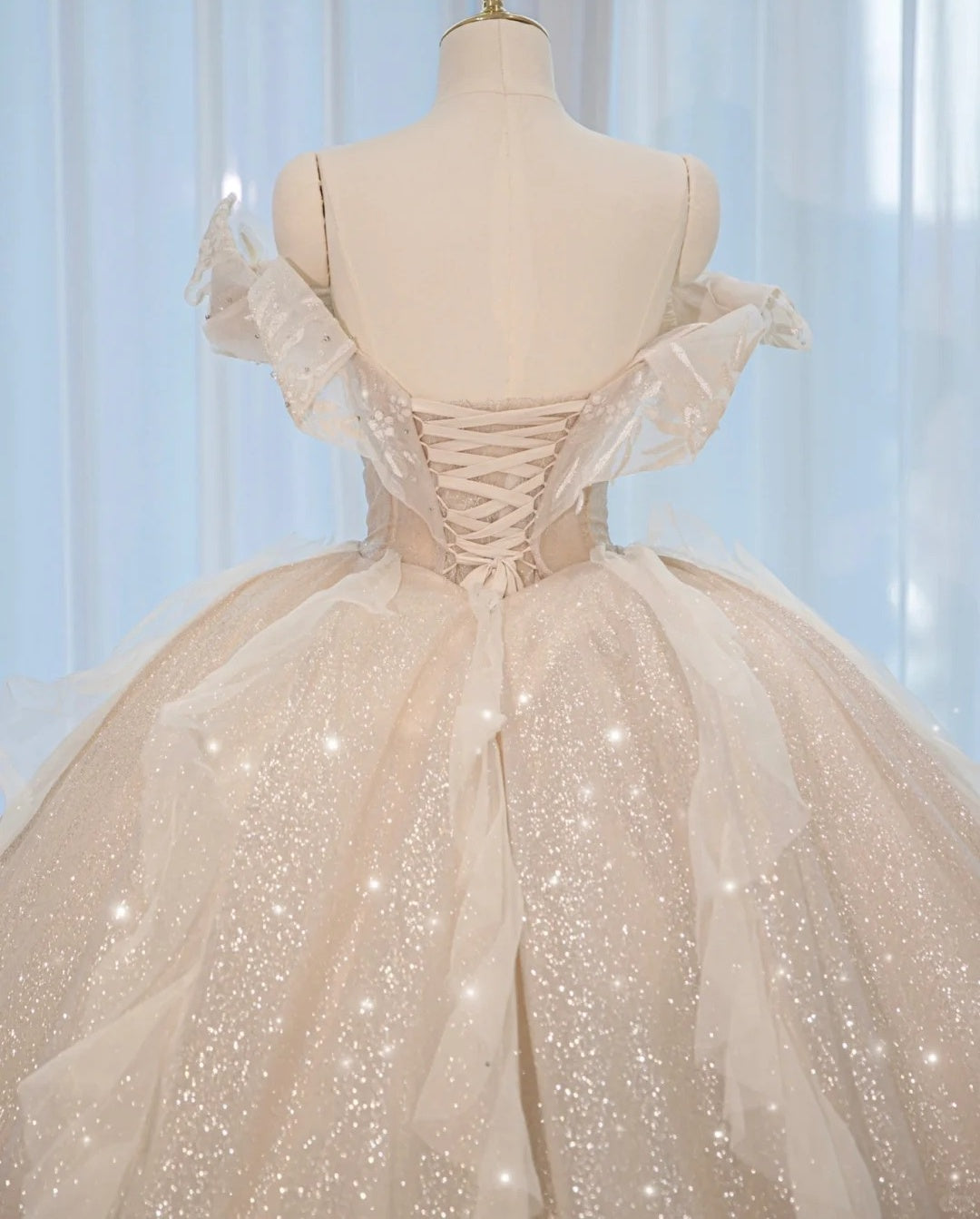 Luxurious Sparkly Cascade Tulle Hem Off-Shoulder Bridal Dress Alluring Crystal Trim Lace-Up Back A-Line Wedding Dress AP2162