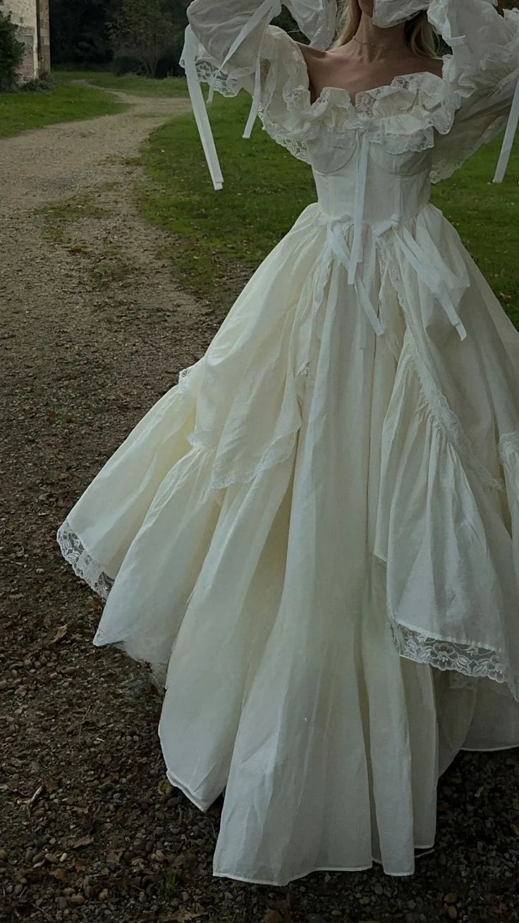 Romantic Off-The-Shoulder Tiered A Line Long Sleeves Wedding Dress With Lace Trim,Bow& Sweep Train AE023