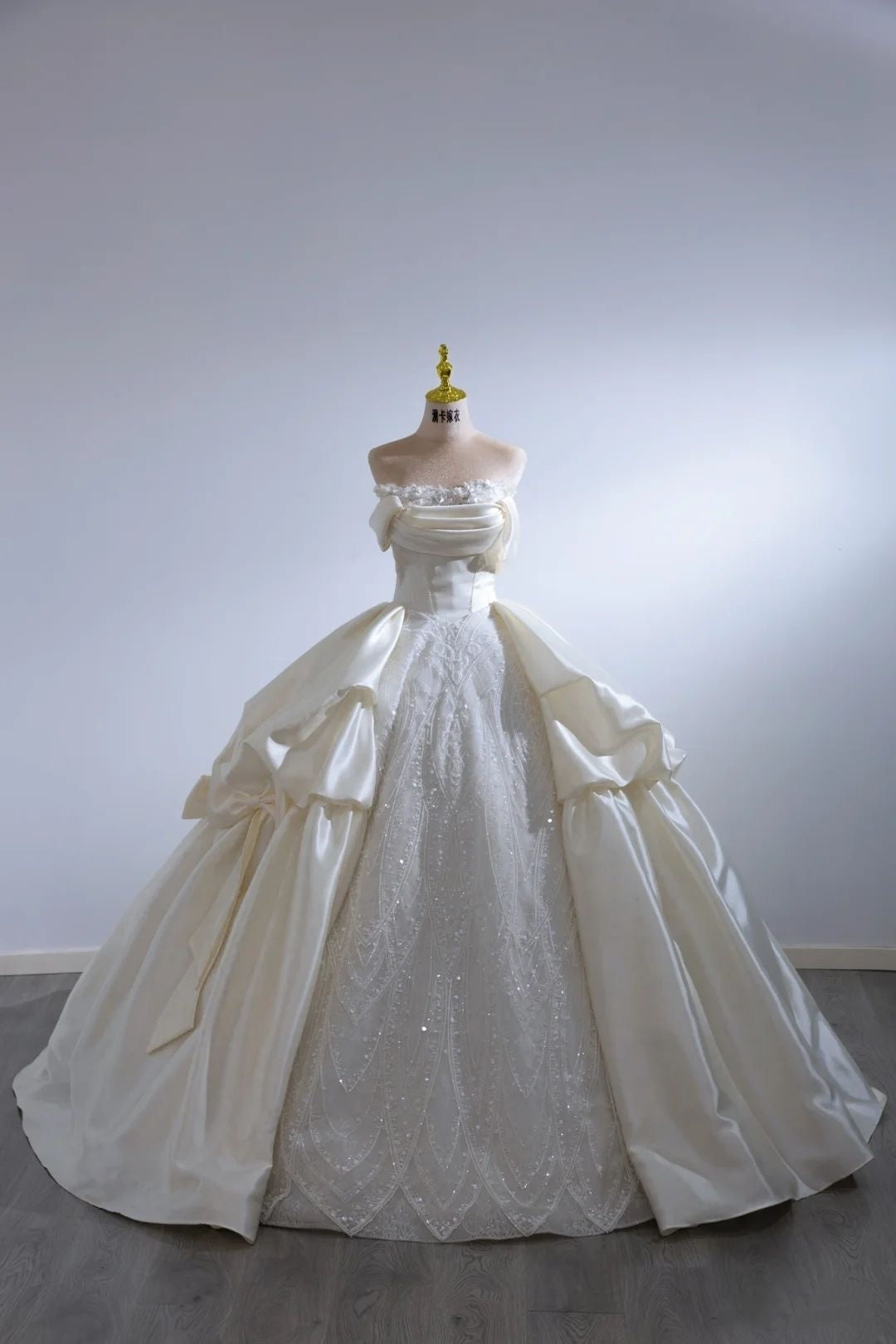 Regal Ivory Off Shoulder Satin & Beaded Lace Ball Gown Wedding Dress With Dramatic Satin Bow And Cathedral Train AE116
