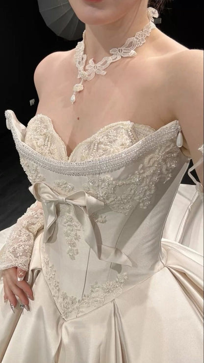 Regal Ivory Strapless Satin Ball Gown Wedding Dress With Hand-Embroidered Lace,Beaded Trim And Bow Detail AE117