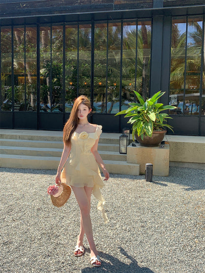 Ethereal Light Yellow Asymmetric Spaghetti Strap Mini Dress Cute 3D Floral Accent Ruffles Hem Short Dress AP2080