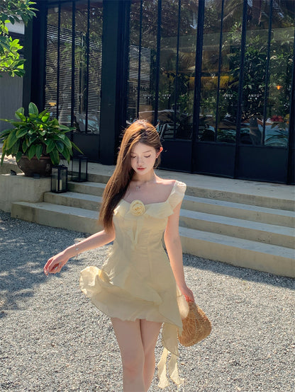 Ethereal Light Yellow Asymmetric Spaghetti Strap Mini Dress Cute 3D Floral Accent Ruffles Hem Short Dress AP2080