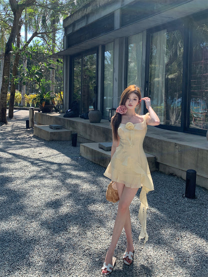 Ethereal Light Yellow Asymmetric Spaghetti Strap Mini Dress Cute 3D Floral Accent Ruffles Hem Short Dress AP2080