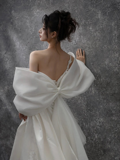 Glamorous One-Shoulder Bow Back 3D Floral Accent Maxi Bridal Dress Elegant Satin Drape Bodice Cascade Tulle Hem Wedding Dress AP2200