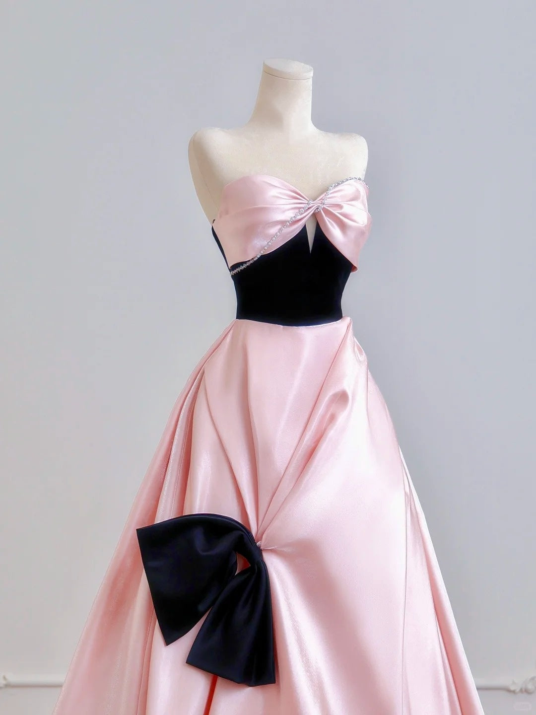 Luxurious Beading Strapless Pink Satin Ruched Evening Maxi Dress Cute Cutout Black Bodice Big Bow Accent Prom Dress AP2222