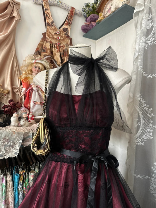 Alluring Burgundy Satin Sleeveless Tulle Halter Bow Neck Lace Waist Satin Sash Black Tulle Overlay Sequin Floral Applique A‑Line Midi Homecoming Dress AS2435